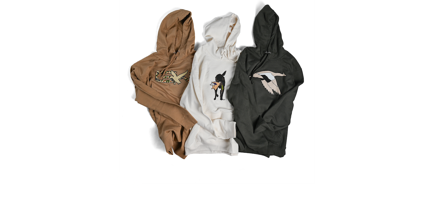 Three Gator Waders Hoodies laying on a table. 